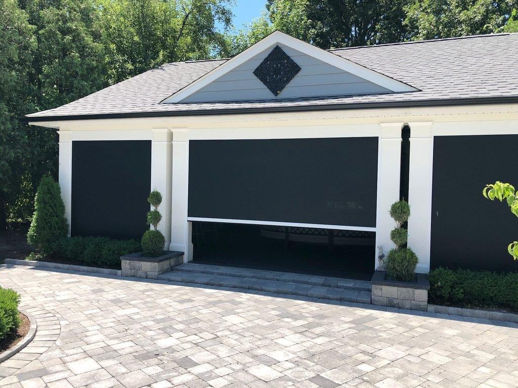 Recessed retractable privacy and solar screens.