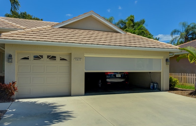 Retractable Roll screen installed on your garage.